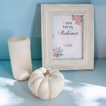 Happy Sunday! Simple #decorating tip: group items in three and use varying heights. There's not much more simplistic than a candle, pumpkin, and frame, but together they make such a nice little #vignette, don't you think?